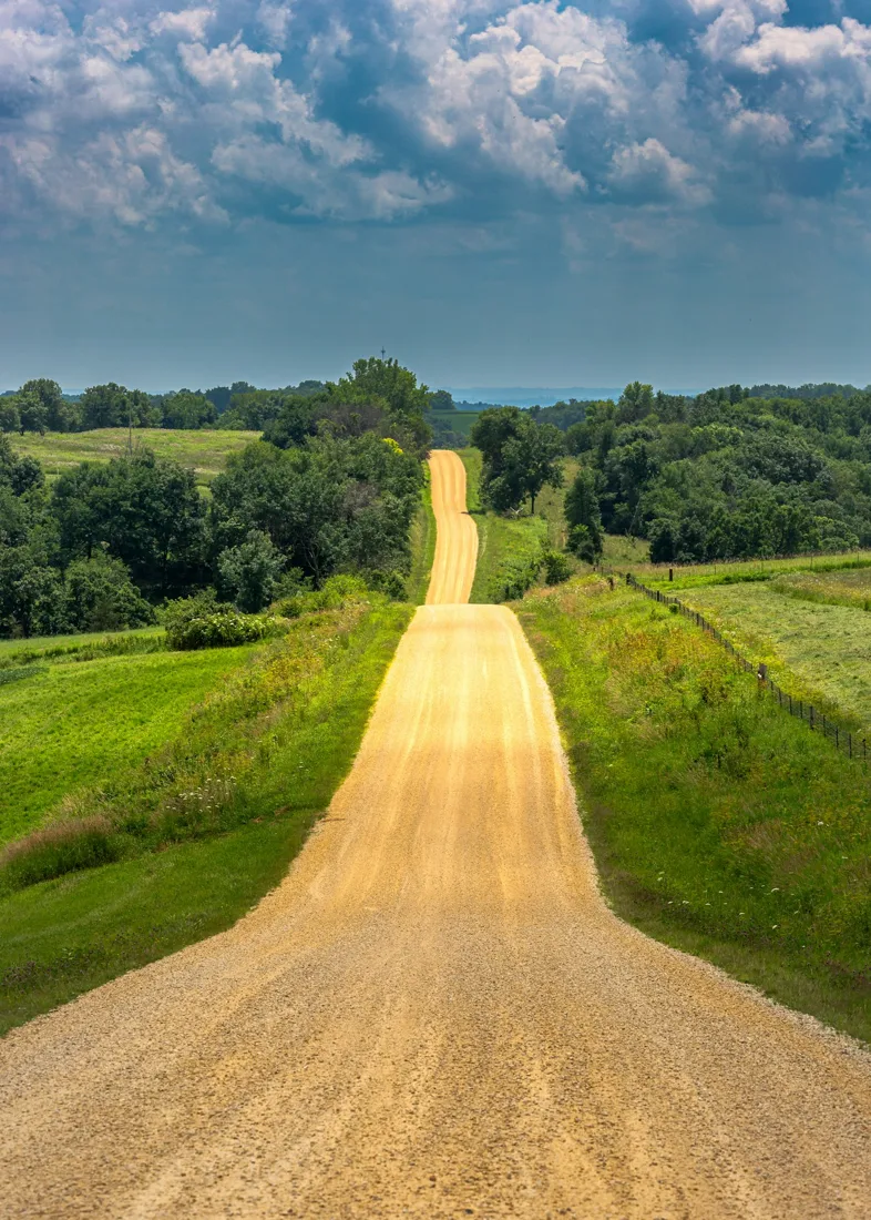 Unpaved access route over rolling ground