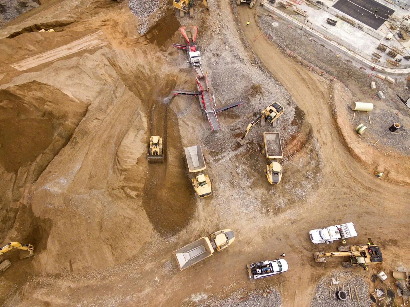 Aerial view of earthmoving equipment and work areas